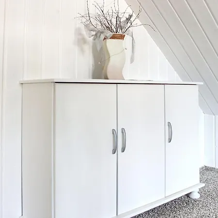 Nyaraló Windspiel Kleeden